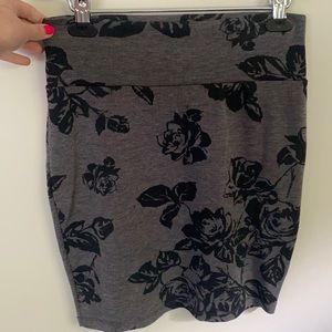 Comfy shirt but not mini skirt. Fitted. Flowered.